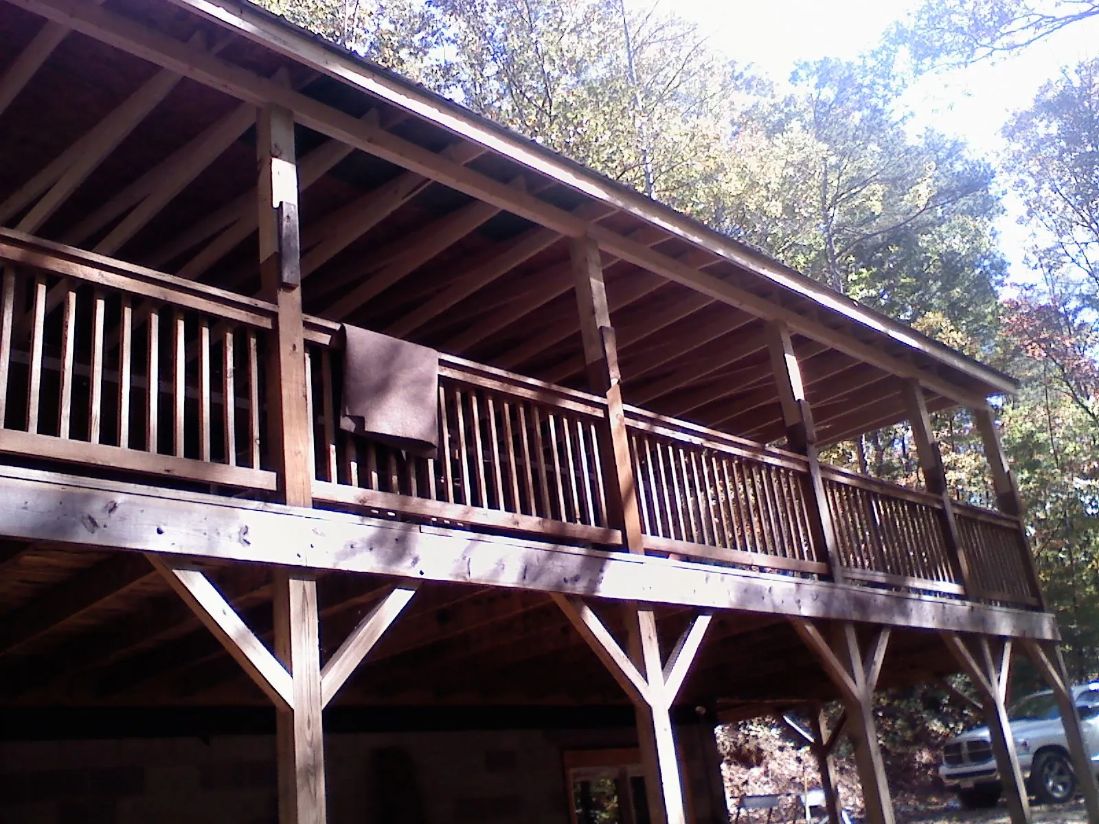 Timber framing under a new elevated porch and deck — Roof Leak Repair in Noble by Roofing Brothers
